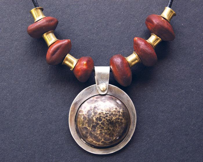 Texas Ebony seeds, domed textured brass, silver, brass accents